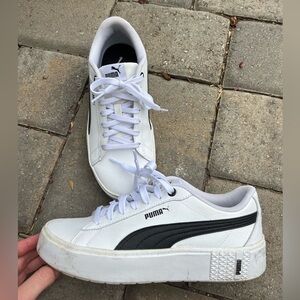 White and black pumas with soft foam built in shoe inserts